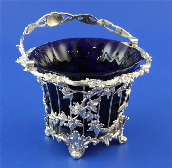 A Victorian pierced silver sugar basket by Edward & John Barnard, height 6.75in inc. handle.